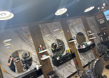 Barbershop commercial electrical fit-out, Calgary, with round mirror station lighting