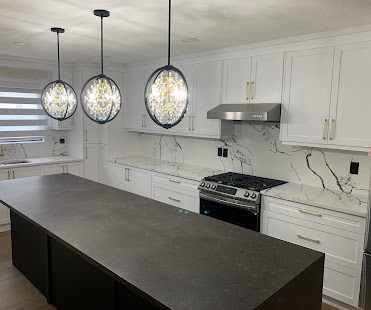 Crystal pendant trio over kitchen island in renovated Calgary home